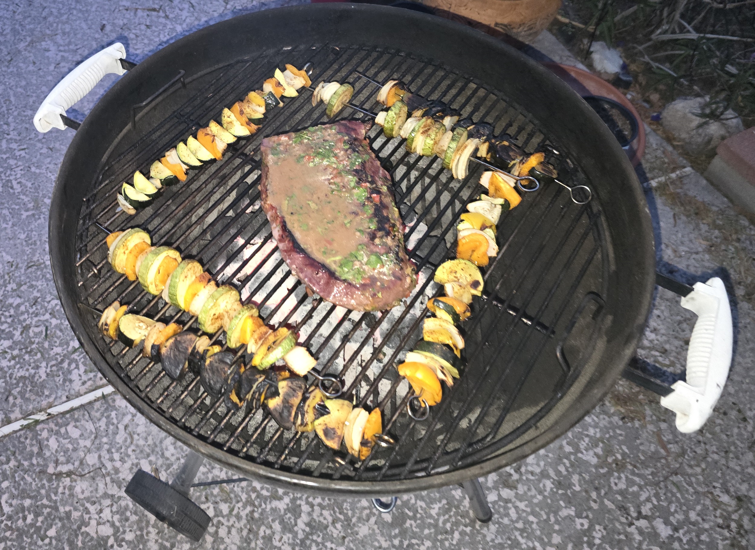 London Broil grilling over high heat on the grill